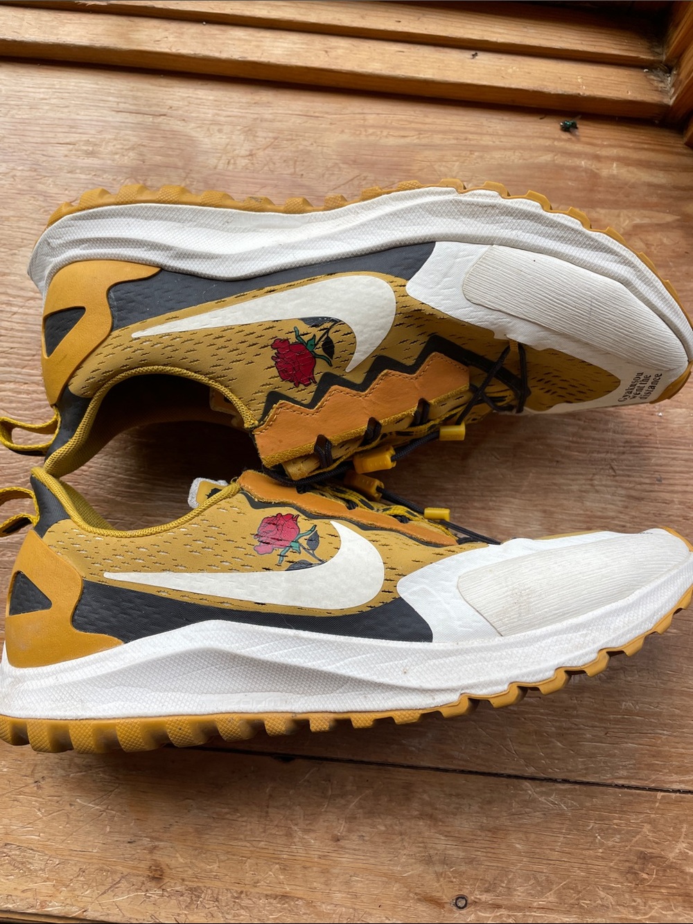 Nike Yellow Trail Sneakers with White Swoosh and Red Rose Accent
